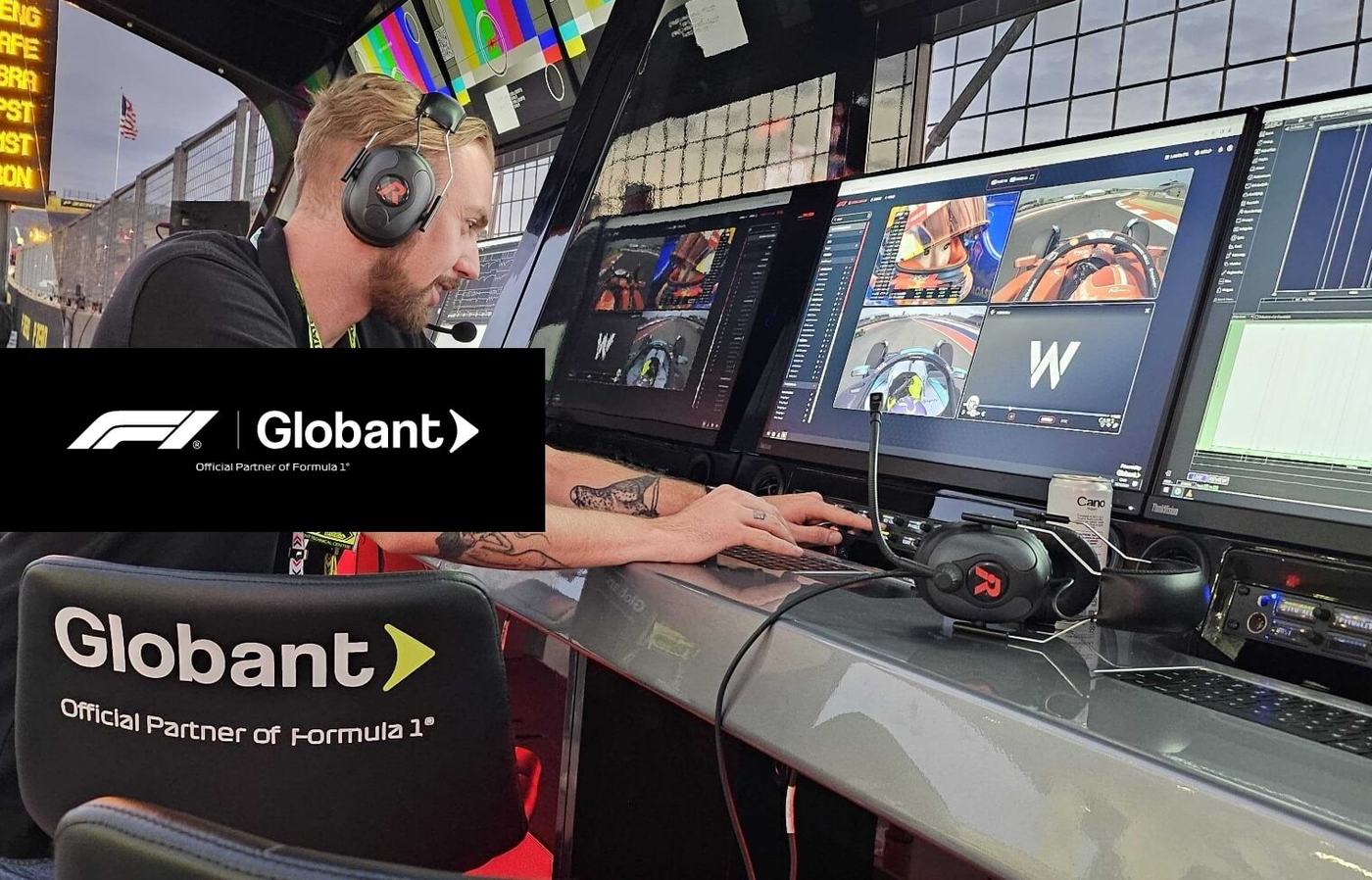 Globant and Formula 1 team working in a race-day garage